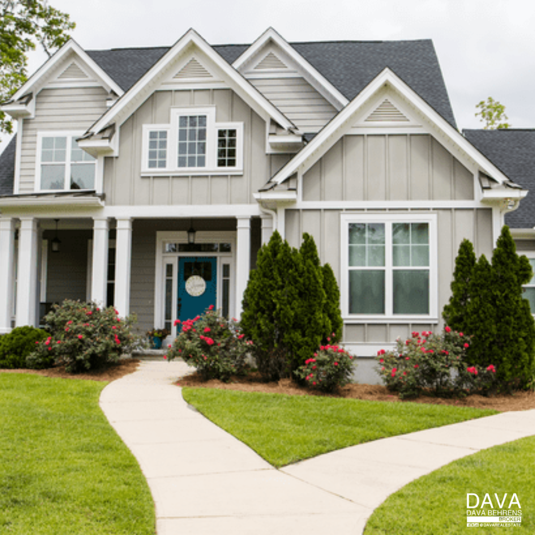 Gray house with teal front door.