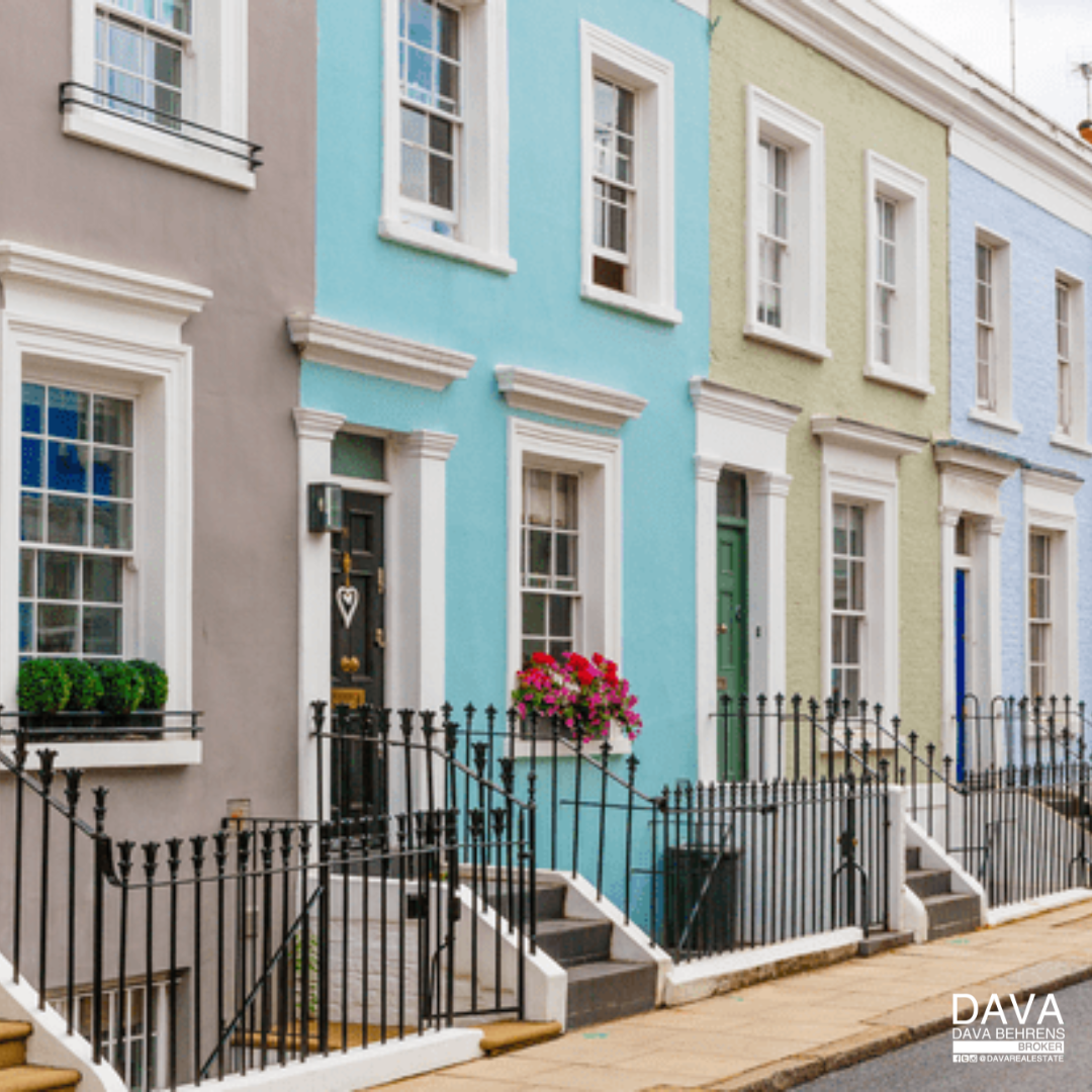 Colorful terraced houses with railings.