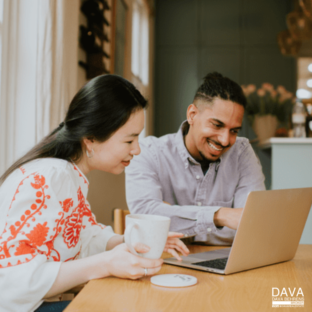 Couple looking at laptop together.