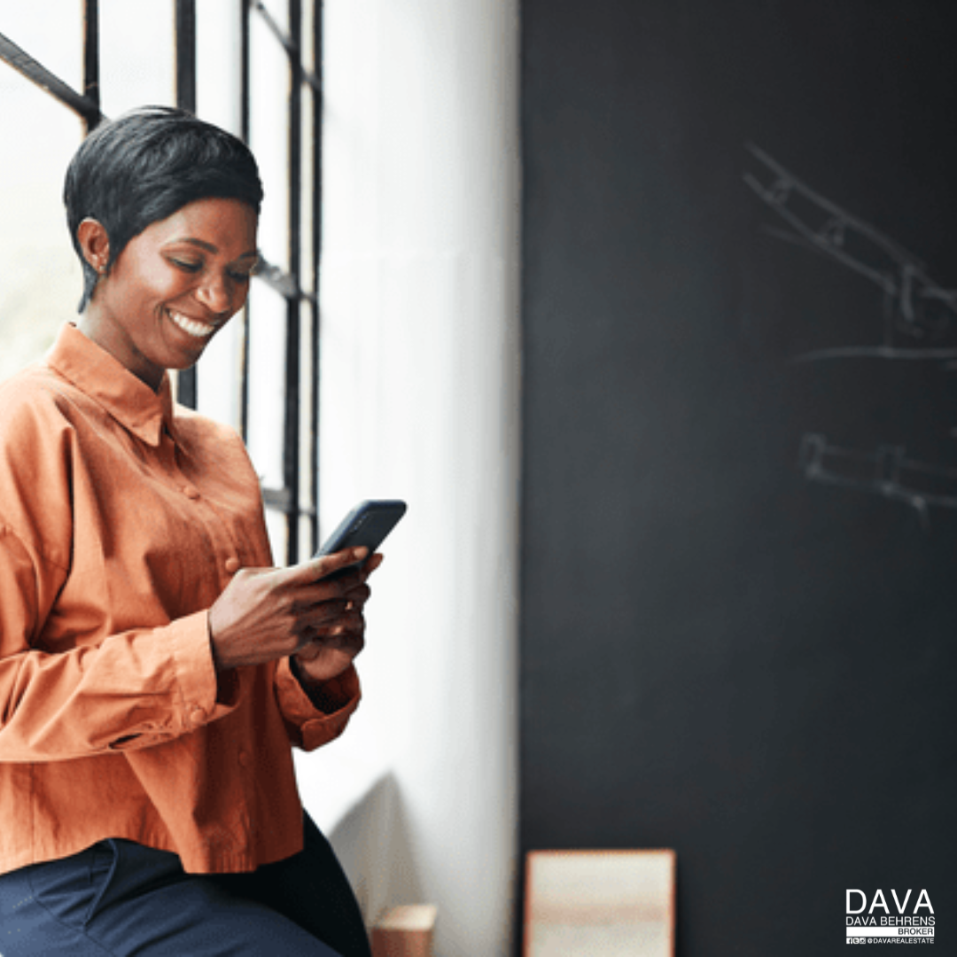 Smiling woman checking her phone.