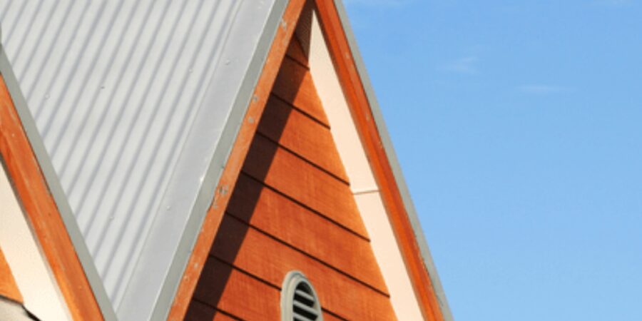Roof corner with blue sky background.