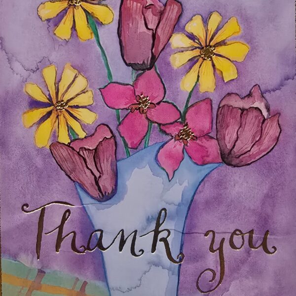 Colorful flowers in a vase with text.