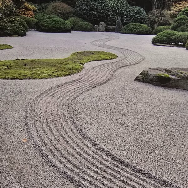 Zen garden with raked gravel patterns.