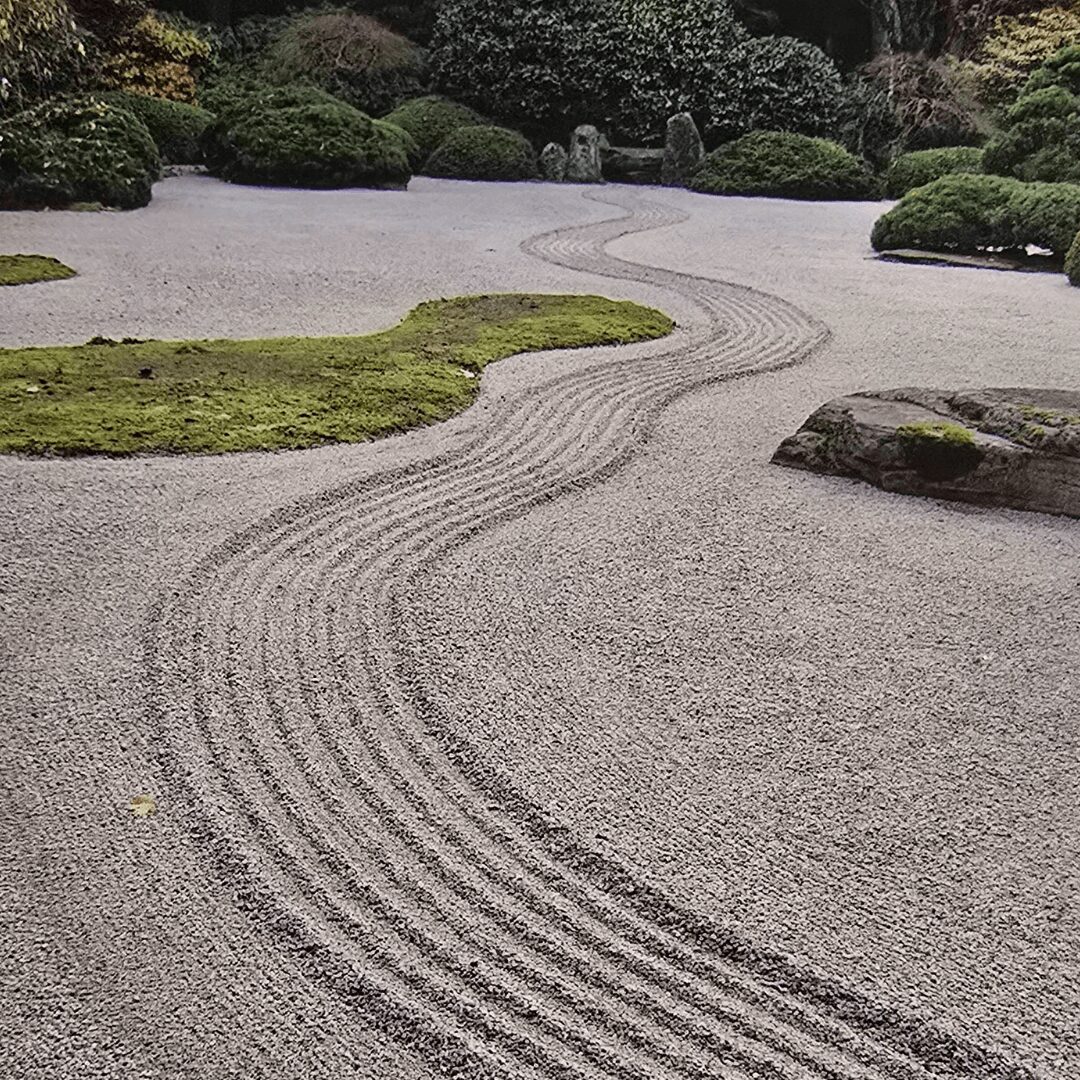 Zen garden with raked gravel patterns.