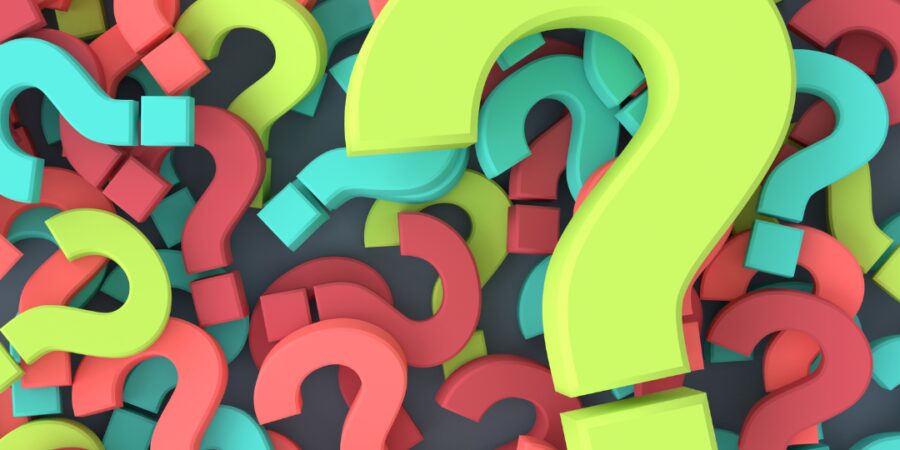 Colorful question marks on a dark background.