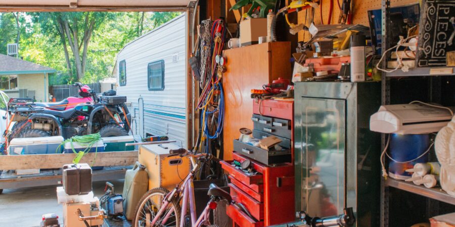 Cluttered garage with bicycles and tools.