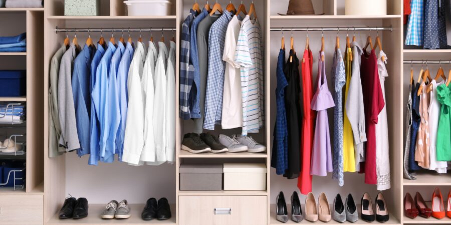 Neatly organized closet with various clothing items.