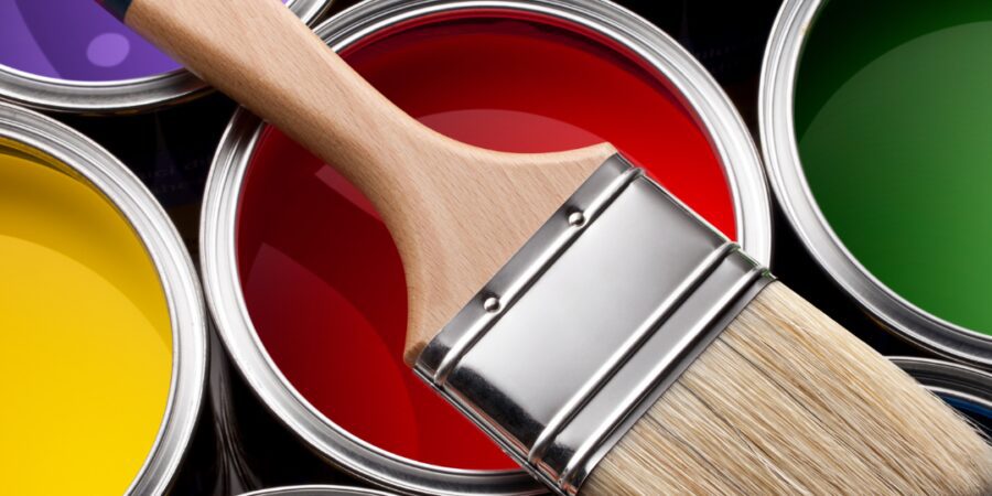 Colorful paint cans with a brush.