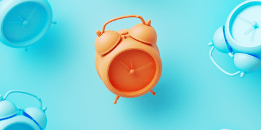 Colorful alarm clocks on a blue background.