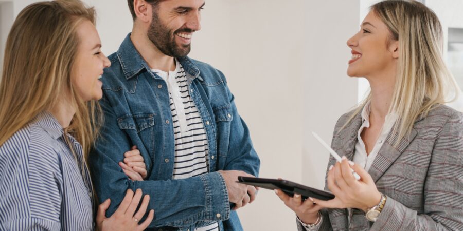 Three people discussing in modern interior.