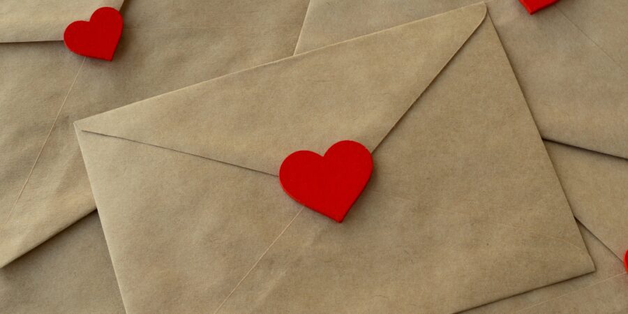 Brown envelopes decorated with red heart seals.