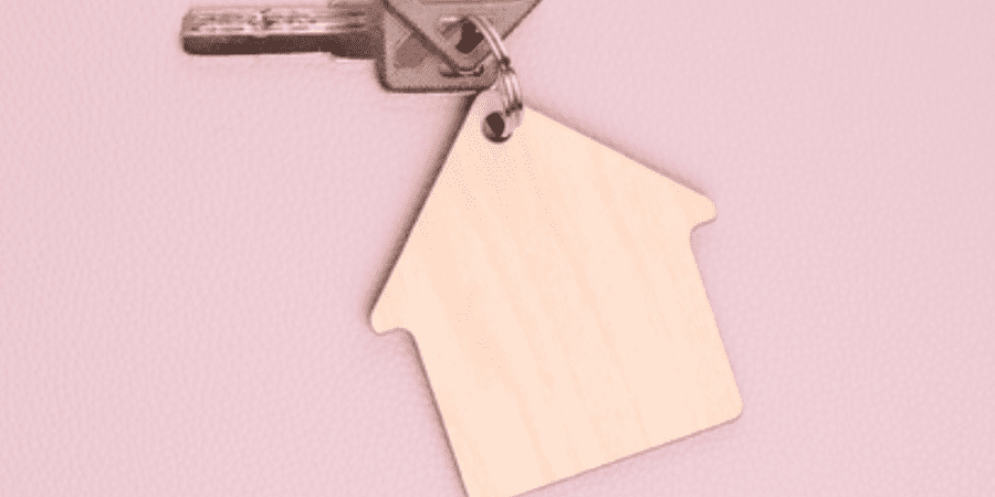 House-shaped keychain with keys.