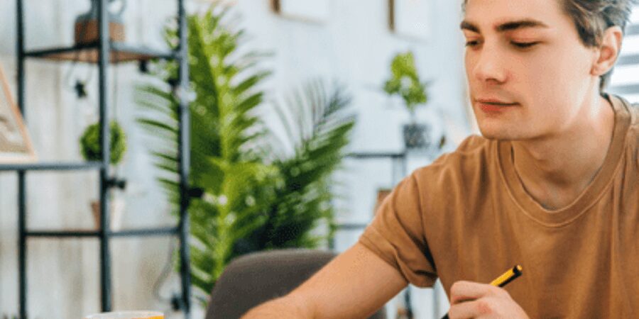 Man working on laptop at home.