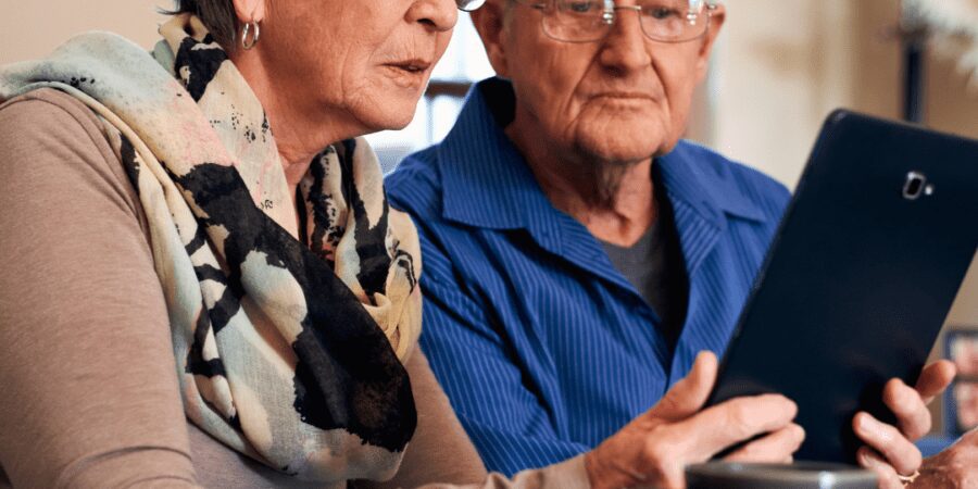 Senior couple using tablet together.