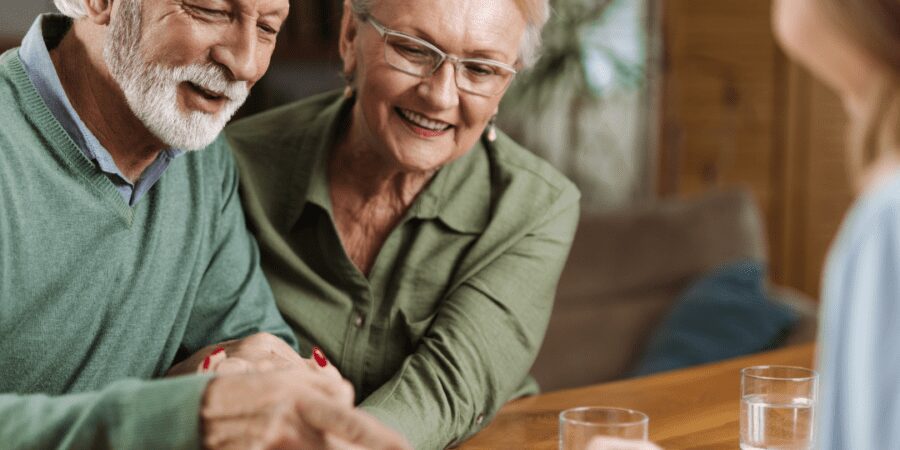 Happy senior couple reviewing documents.