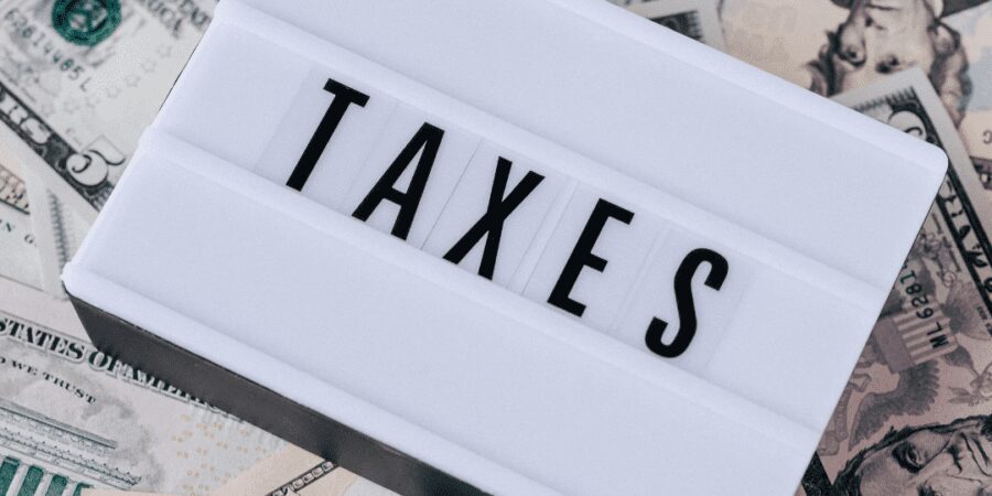 Taxes on a pile of money.