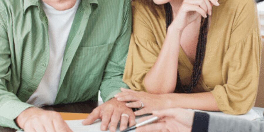 People reviewing documents at a table.