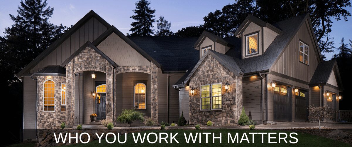 Luxury home exterior at dusk with text.