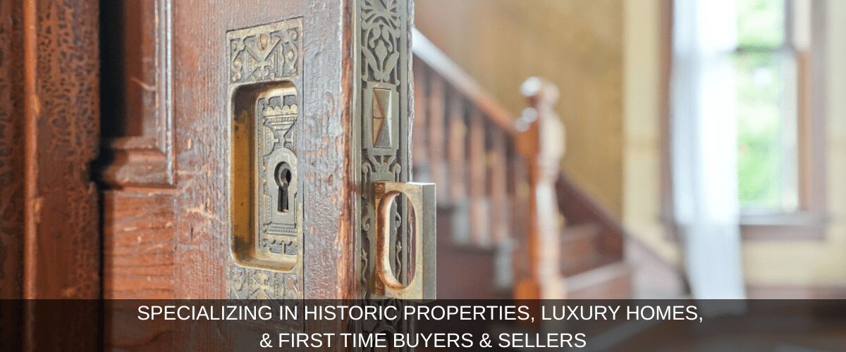Intricate door lock in historic home setting.