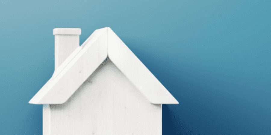 White house model on blue background.